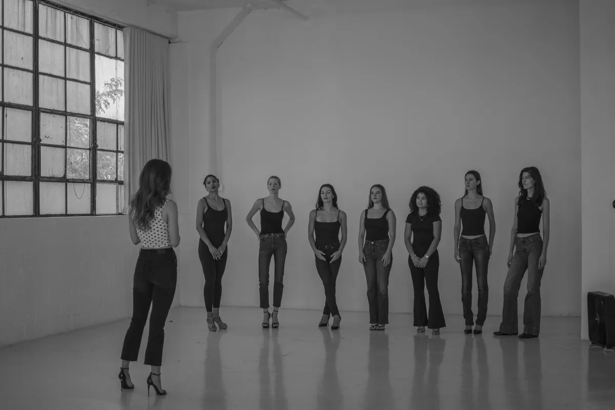 Against the white wall